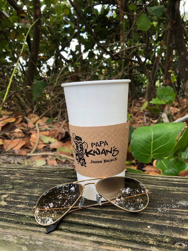 Papa Kwan's coffee cup on the beach in Juno Beach