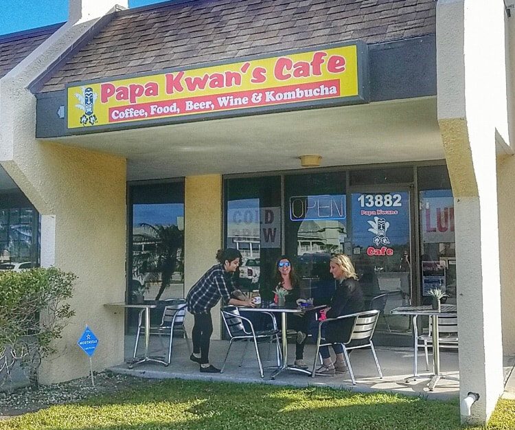 Papa Kwan's Cafe storefront with outdoor seating